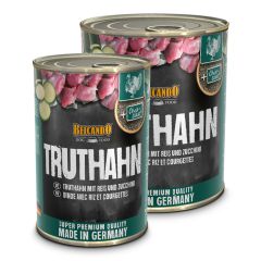 zwei runde Aludosen mit grünen Details und Fotos vom Futterinhalt, auf der Verpackung stehen die Produktinformationen